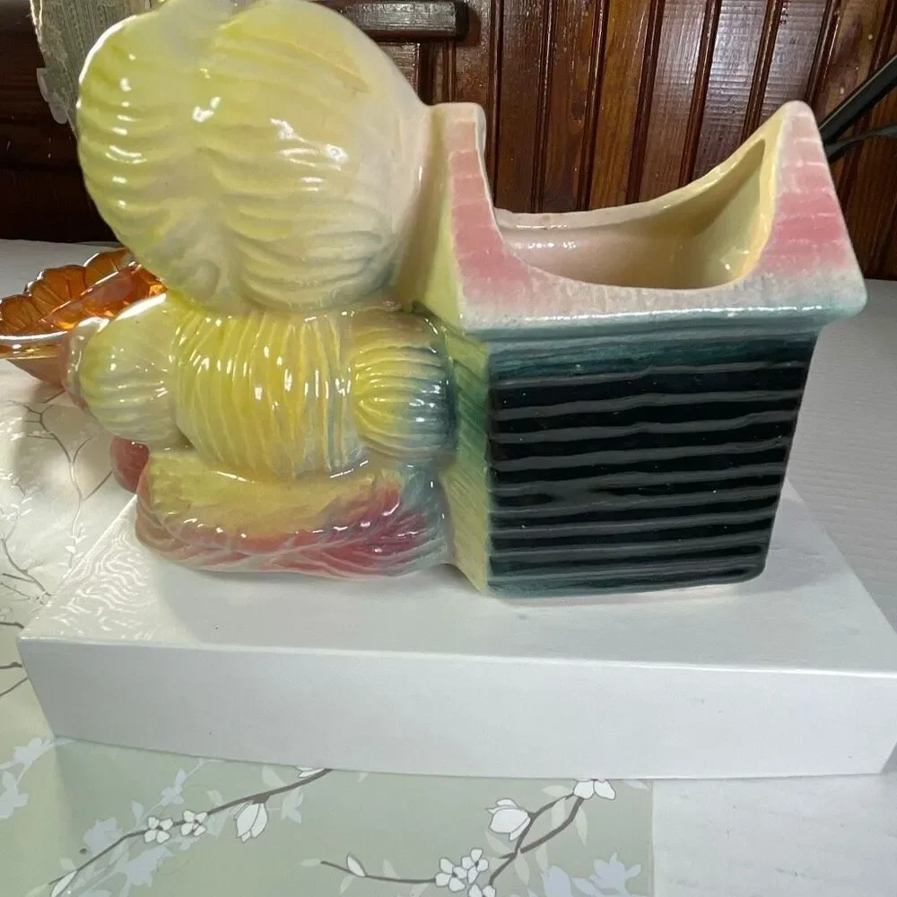 Vintage ceramic American Bisque Yarn Doll planter.